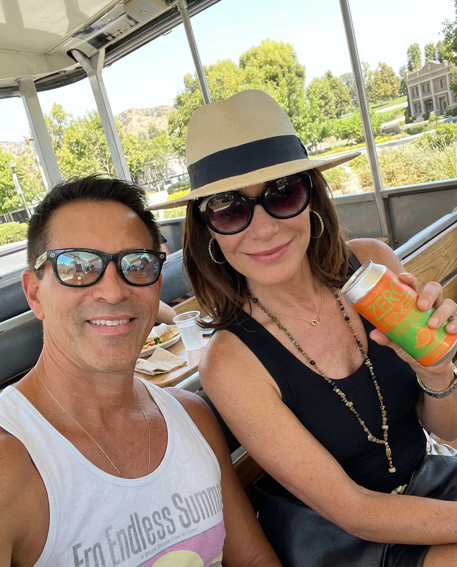 Jorge Cruise with Luann de Lesseps at Universal Studios holding the original Zero Hunger Water can